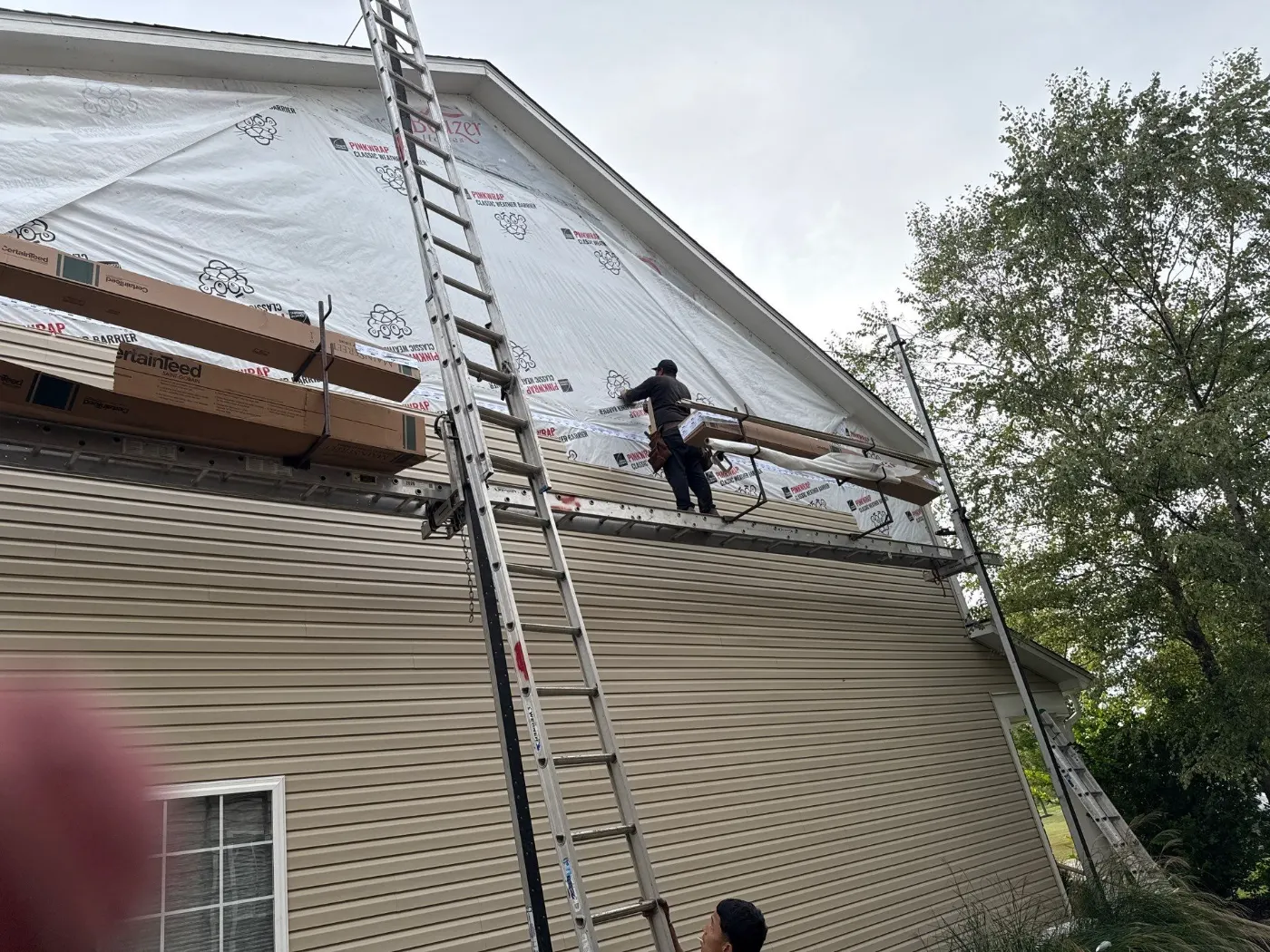 Siding installation documented in McCordsville
